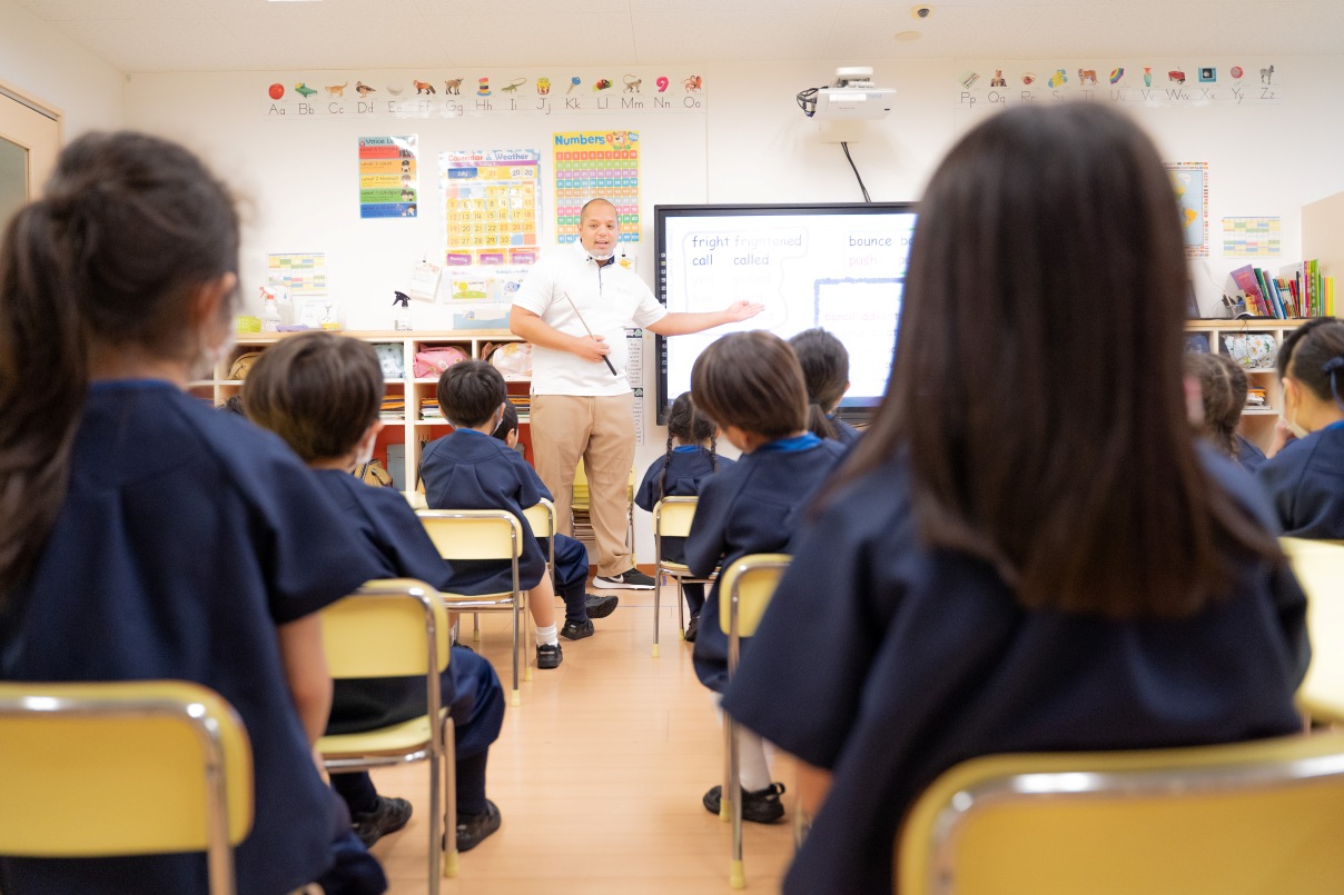 Teacher standing in front of class